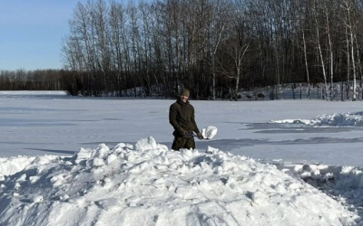 Czech soldiers training survival skills in deep snow during the SERE Extreme Cold Weather Course in Canada